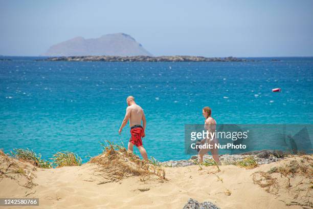 Tourism in Greece - The exotic beach of Falassarna at the western side of Crete island during a high-temperature day, heatwave. Falasarna bay with 5...