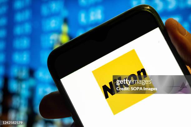 In this photo illustration, the Japanese multinational electronics corporation and manufacturer Nikon logo is displayed on a smartphone screen.