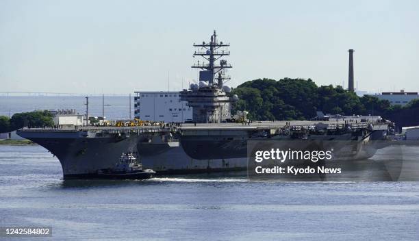 The U.S. Nuclear-powered aircraft carrier Ronald Reagan returns to base in Yokosuka, eastern Japan, on Aug. 19 after being deployed to monitor...