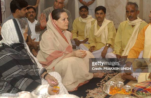 Congress President and Opposition Leader Sonia Gandhi offers worship to Hindu god Lord Krishna along with Delhi's Chief Minister Shiela Dikshit at...