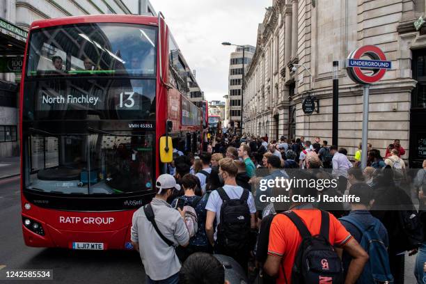 Commuters queue for buses outside Victoria underground train station which is closed due to strike action on August 19, 2022 in London, England. Tube...