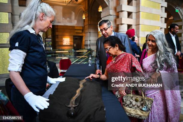 Guests look at a ceremonial Indo-Persian sword is displayed during a transfer of ownership ceremony at Kelvingrove Art Gallery and Museum in Glasgow...