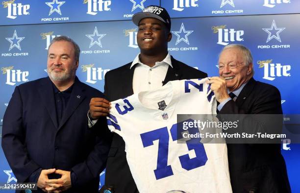 Dallas Cowboys first round draft pick Tyler Smith, center, is one of three rookie competing for starting jobs.