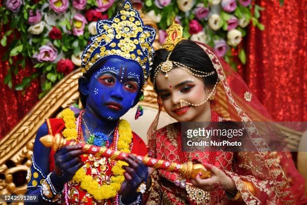 Children dressed as Hindu god Lord Krishna as he takes part in a procession during celebrations for the 'Janmashtami' festival, which marks the birth...