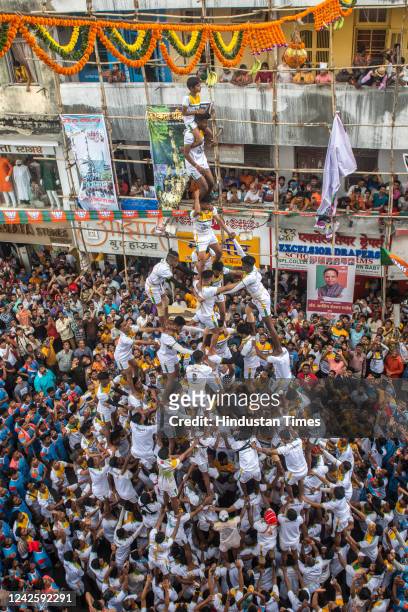 Govindas form a human pyramid to break the Dahi Handi on the occasion of Gokulashtami festival at Dadar on August 19, 2022 in Mumbai, India. The Dahi...