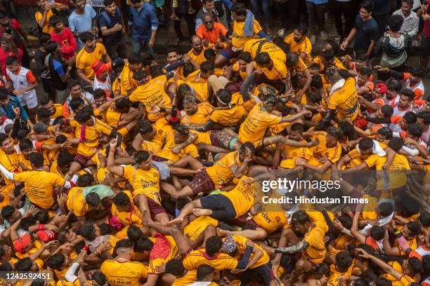 Govindas break the Dahi Handi by forming a human pyramid on the occasion of Gokulashtami festival at Dadar on August 19, 2022 in Mumbai, India. The...