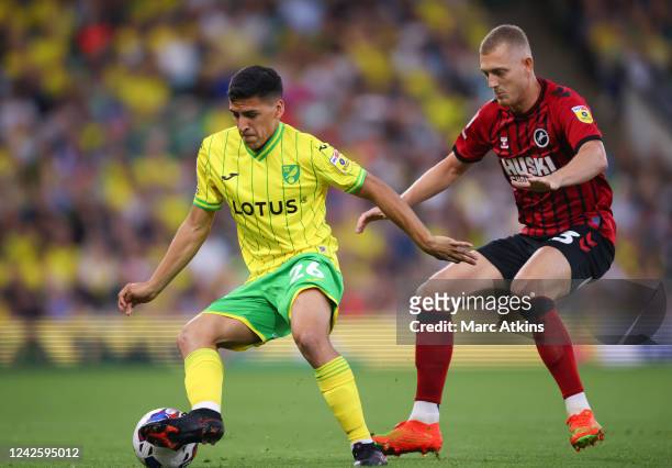 Marcelino Nunez of Norwich City in action with George Saville of Millwall during the Sky Bet Championship between Norwich City and Millwall at Carrow...
