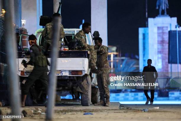 Security forces patrol near the Hayat Hotel after an attack by Al-Shabaab fighters in Mogadishu on August 20, 2022. - Al-Shabaab fighters attacked a...