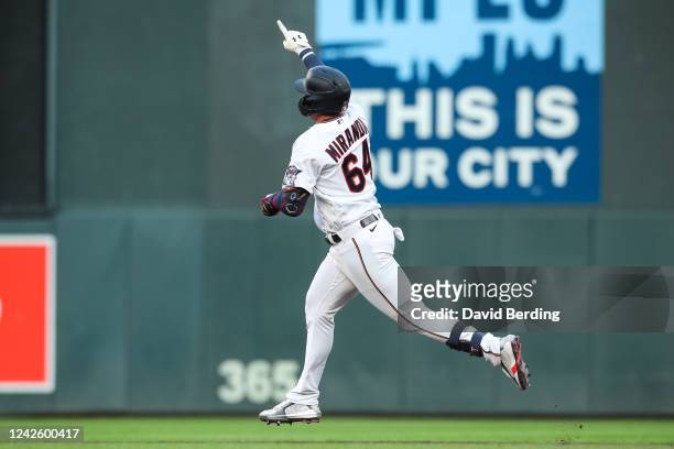 Jose Miranda of the Minnesota Twins celebrates his solo home run after going back-to-back with Luis Arraez against the Texas Rangers in the first...