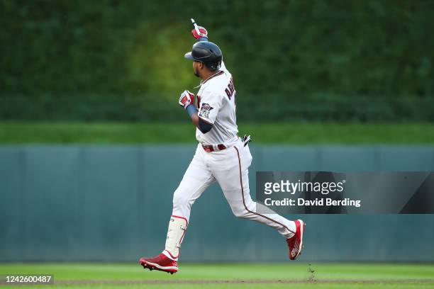 Luis Arraez of the Minnesota Twins celebrates his solo home run as he rounds the bases against the Texas Rangers in the first inning of the game at...