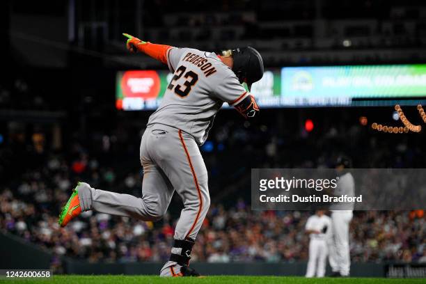Joc Pederson of the San Francisco Giants celebrates after hitting a sixth inning solo home run against the Colorado Rockies at Coors Field on August...
