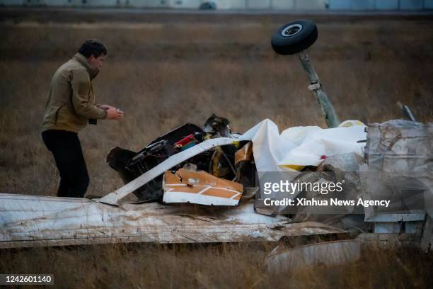 An investigator works at the site of the plane crash in Watsonville Municipal Airport of Watsonville, California, the United States, Aug. 18, 2022....
