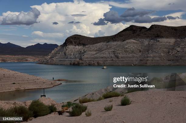 Bleached 'bathtub ring' is visible on the banks of Lake Mead near Echo Bay on August 18, 2022 in Lake Mead National Recreation Area, Nevada. The...