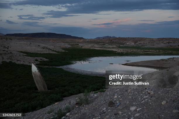 Formerly sunken boat stands upright in a section of Lake Mead that was previously under water on August 18, 2022 in Lake Mead National Recreation...