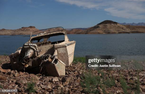 Formerly sunken boat sits on dry land in a section of Lake Mead that was previously under water on August 19, 2022 in Lake Mead National Recreation...