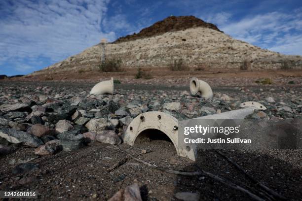 Water intake pipes sit on ground in front of Pyramid Island on a section of Lake Mead that was previously underwater on August 19, 2022 in Lake Mead...