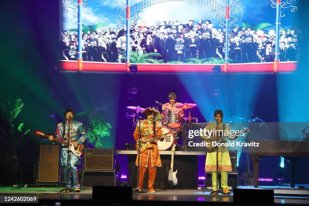 Neil Candelora as Paul, J.T. Curtis as George, Chris McBurney as Ringo and Michael Gagliano as John perform during Let It Be: A Celebration Of The...