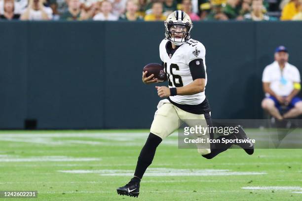 New Orleans Saints quarterback Ian Book scrambles during an NFL preseason game between the Green Bay Packers and the New Orleans Saints on August 19...