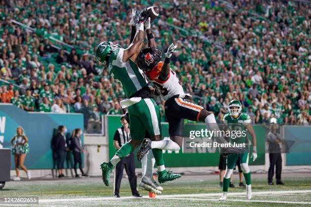 Emmanuel Rugamba of the BC Lions breaks up a pass intended for D'haquille Williams of the Saskatchewan Roughriders in the game between the BC Lions...