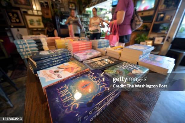 School librarians look through books at a book giveaway event for educators, sponsored by the Florida Freedom to Read Project, on Tuesday, August 2,...