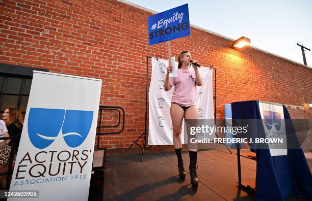 Velveeta, a stripper, addresses the crowd attending a rally in support of strippers from the Star Garden Topless Dive Bar on August 19, 2022 in North...