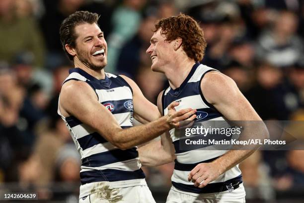 Gary Rohan of the Cats celebrates a goal with Isaac Smith of the Cats during the round 23 AFL match between the Geelong Cats and the West Coast...