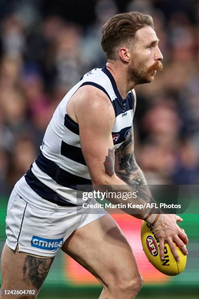 Zach Tuohy of the Cats runs with the ball during the round 23 AFL match between the Geelong Cats and the West Coast Eagles at GMHBA Stadium on August...