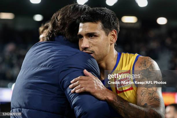 Tim Kelly of the Eagles is seen with Chris Scott, Senior Coach of the Cats during the round 23 AFL match between the Geelong Cats and the West Coast...