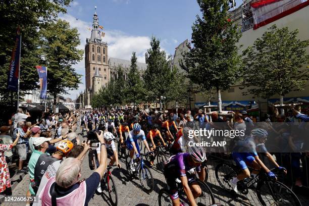 The peloton during the start of the second stage of the Vuelta a Espana . The second stage of the Vuelta goes from Den Bosch to Utrecht.