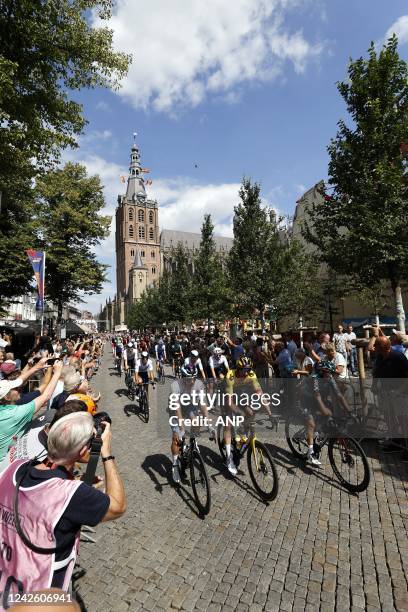 The peloton during the start of the second stage of the Vuelta a Espana . The second stage of the Vuelta goes from Den Bosch to Utrecht.