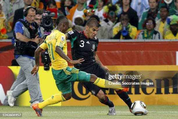 Mexico Carlos Salcido , South Africa Teko Modise during the World Cup match between South Africa v Mexico on June 11, 2010