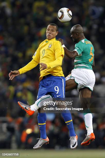 Luis Fabiano of Brazil , Didier Zokora of Ivory Coast during the World Cup match between Brazil v Ivory Coast on June 20, 2010