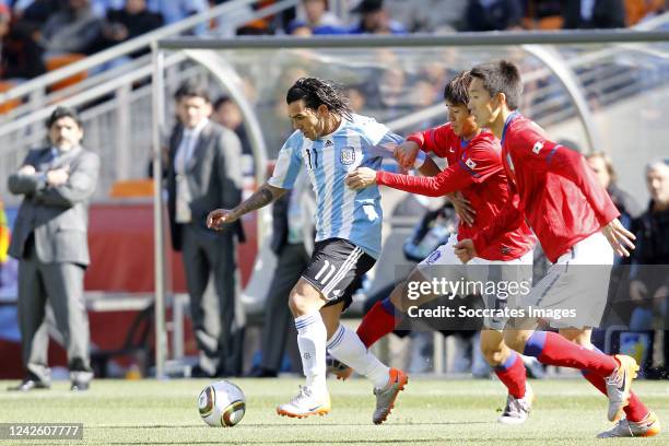 Carlos Tevez of Argentina , Oh Beom Seok of South Korea during the World Cup match between Argentina v Korea Republic on June 17, 2010