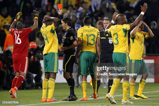 Itumeleng Khune, Aaron Mokoena, Referee Massimo Busacca, Kagisho Dikgacoi, Tsepo Masilela, Steven Pienaar during the World Cup match between South...