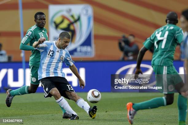 Walter Samuel of Argentina, Victor Obinna of Nigeria during the World Cup match between Argentina v Nigeria on June 12, 2010