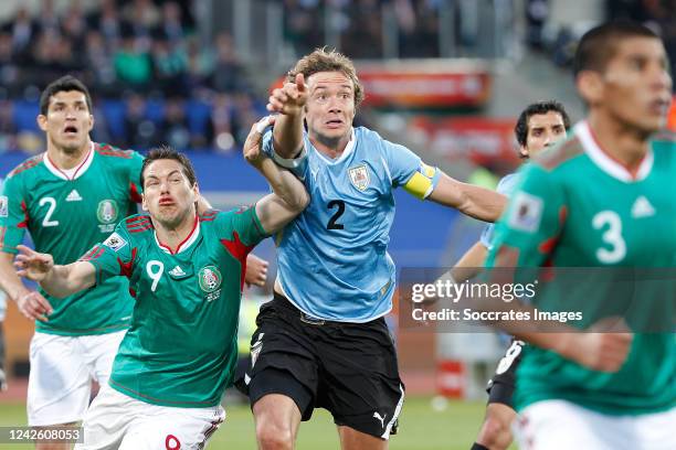 Uruguay Diego Lugano Mexico Guillermo Franco during the World Cup match between Uruguay v Mexico on June 22, 2010