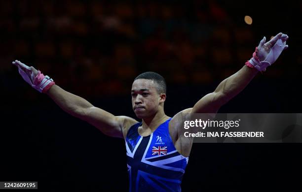 Britain's Joe Fraser reacts after performing his routine on the rings during the Men's Team Final event at the European Artistic Gymnastics...