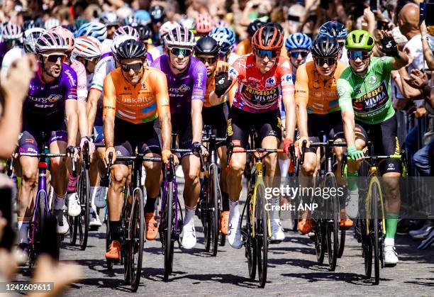 Robert Gesink in the red jersey and Primoz Roglic in the green jersey during the start of the second stage of the Vuelta a Espana . The second stage...