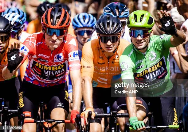 Robert Gesink in the red jersey and Primoz Roglic in the green jersey during the start of the second stage of the Vuelta a Espana . The second stage...