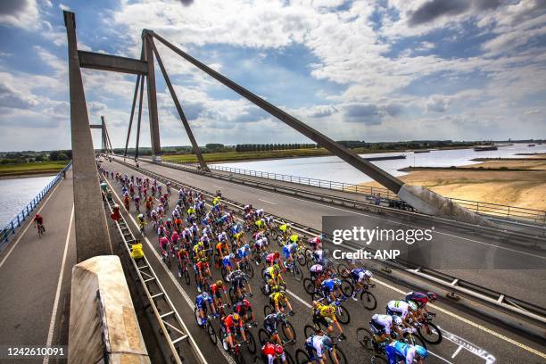 Atmospheric image of the peloton that passes the Waal over the Prince Willem Alexander Bridge near Ooij during the second stage of the Tour of Spain...