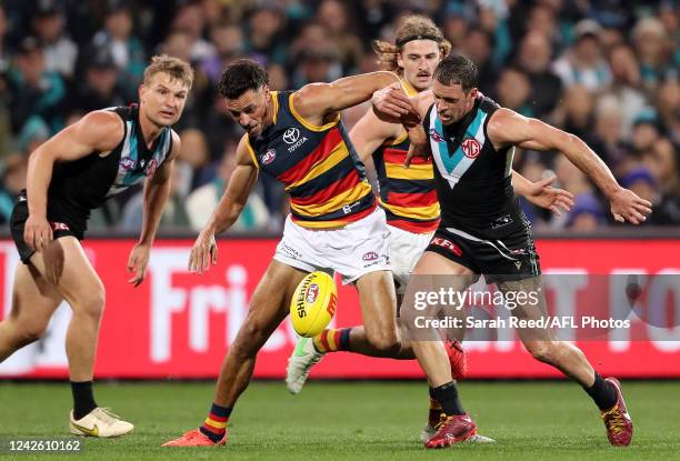 Ben Davis of the Crows and Travis Boak of the Power during the 2022 AFL Round 23 match between the Port Adelaide Power and the Adelaide Crows at...