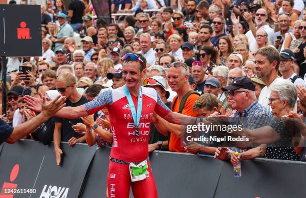 Alistair Brownlee of Great Britain reacts after winning IRONMAN Kalmar on August 20, 2022 in Kalmar, Sweden.