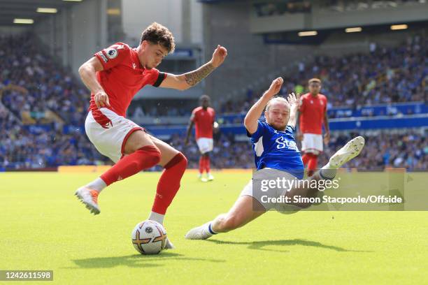 Neco Williams of Nottingham Forest battles with Tom Davies of Everton during the Premier League match between Everton FC and Nottingham Forest at...