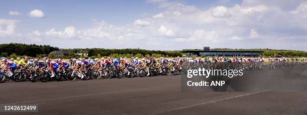 The peloton passes the runway of Soesterberg Air Base during the second stage of the Vuelta a Espana . The second stage of the Vuelta goes from Den...