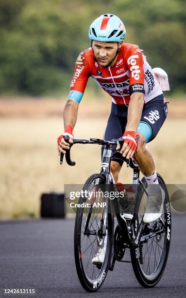 An injured Kamil Malecki of team Lotto Soudal passes the runway at Soesterberg Air Base during the second stage of the Vuelta a Espana . The second...