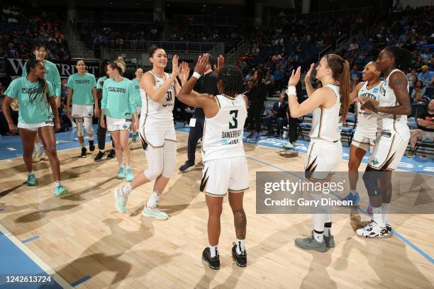 Stefanie Dolson of the New York Liberty high fives Crystal Dangerfield of the New York Liberty prior to the game against the Chicago Sky during Round...