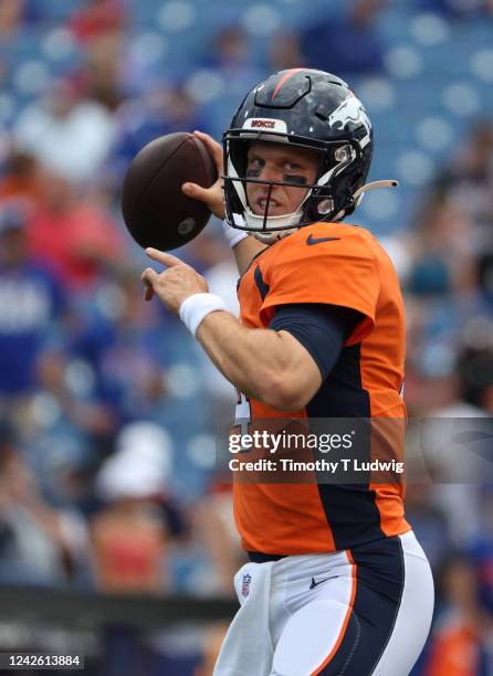 Brett Rypien of the Denver Broncos throws a pass before a preseason game against the Buffalo Bills at Highmark Stadium on August 20, 2022 in Orchard...