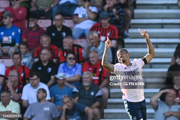 Arsenal's Brazilian striker Gabriel Jesus celebrates his team second goal scored by Arsenal's Norwegian midfielder Martin Odegaard during the English...