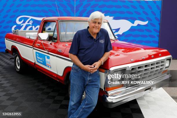 Comedian Jay Leno poses in front of a 1979 Ford F-150 pickup, in the style of one owned by Walmart founder Sam Walton, on August 20 during the 27th...