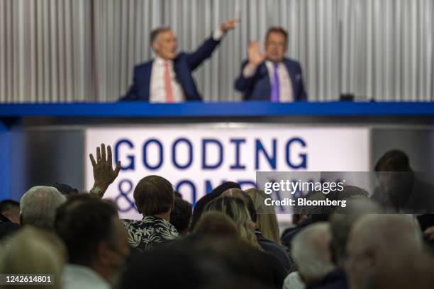 An attendee makes a bid during the Gooding and Company auction at the 2022 Pebble Beach Concours d'Elegance in Pebble Beach, California, US, on...